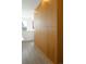 A well-lit hallway features sleek wooden cabinetry, providing stylish storage and a modern aesthetic at 285 Clementina St, Louisville, CO 80027