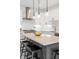 Modern kitchen featuring a large island with seating and stainless steel appliances at 285 Clementina St, Louisville, CO 80027