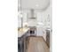 Bright kitchen features a Wolf range, sleek countertops, and stainless steel appliances at 285 Clementina St, Louisville, CO 80027