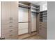This custom walk-in closet provides generous storage and organizational options with shelves and rods at 285 Clementina St, Louisville, CO 80027