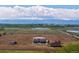 Expansive countryside estate with mountain views and a house, barn, and shed nearby at 3160 Bella Rosa Pkwy, Longmont, CO 80504