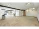 Open basement with concrete flooring and exposed beams offers flexible space for various uses and customization at 3160 Bella Rosa Pkwy, Longmont, CO 80504