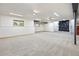 Spacious basement with carpet and a climbing wall offers potential for customization and recreation at 3160 Bella Rosa Pkwy, Longmont, CO 80504