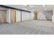 Spacious finished basement with neutral carpet, recessed lighting, and multiple doors offers versatile living space at 3160 Bella Rosa Pkwy, Longmont, CO 80504
