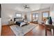 Bedroom with large windows, soft rug, and tiled floor at 3160 Bella Rosa Pkwy, Longmont, CO 80504