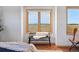 Bedroom featuring views, tile floors, and bench seat at 3160 Bella Rosa Pkwy, Longmont, CO 80504