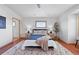 Cozy bedroom featuring a comfortable bed, tiled floor and a soft rug at 3160 Bella Rosa Pkwy, Longmont, CO 80504