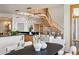 Contemporary dining room with bright lighting, seats six, and offers a view into the living room at 3160 Bella Rosa Pkwy, Longmont, CO 80504