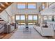Bright living room featuring natural light, modern furniture, and floor-to-ceiling windows with views at 3160 Bella Rosa Pkwy, Longmont, CO 80504