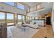Expansive living room with stunning views, modern furnishings, and an open layout at 3160 Bella Rosa Pkwy, Longmont, CO 80504