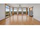 Bright living room with hardwood floors and many windows offering a great view at 3160 Bella Rosa Pkwy, Longmont, CO 80504