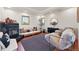 Cozy living area features a fireplace, couch, area rug and a comfortable furry chair at 3160 Bella Rosa Pkwy, Longmont, CO 80504