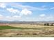 Scenic backyard view overlooking vast open space and the distant mountain range at 8750 Red Primrose St, Franktown, CO 80116
