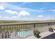 Enjoy the view of the pool and rolling hills from this home's beautiful outdoor balcony at 8750 Red Primrose St, Franktown, CO 80116