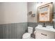 Charming powder room with gray tile accents, modern vanity, and decorative 'flush wash' signs at 8750 Red Primrose St, Franktown, CO 80116