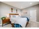 Inviting bedroom with a plush bed, soft lighting, and minimalist decor creating a relaxing ambiance at 8750 Red Primrose St, Franktown, CO 80116