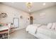 Charming bedroom with bright decor, a white wood accent wall, and a cozy desk area at 8750 Red Primrose St, Franktown, CO 80116