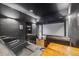 Luxurious home theater featuring plush seating and a large screen for an immersive viewing experience at 8750 Red Primrose St, Franktown, CO 80116