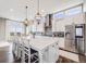 Bright kitchen with a center island, stainless steel appliances, and a breakfast bar at 8750 Red Primrose St, Franktown, CO 80116