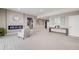 Spacious, neutral-toned living room with modern fireplace and stylish decor accents at 8750 Red Primrose St, Franktown, CO 80116