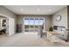 Bright living room with sliding glass doors that open to a pool and expansive outdoor views at 8750 Red Primrose St, Franktown, CO 80116
