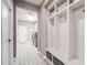 Functional mudroom area with built-in storage and seating, conveniently located near the laundry room at 8750 Red Primrose St, Franktown, CO 80116