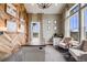 Stylish office with a wood accent wall, carpet flooring, large windows, and modern desk and chair set at 8750 Red Primrose St, Franktown, CO 80116