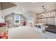 Bright and spacious playroom with vaulted ceilings, creative storage, and plenty of space for activities at 8750 Red Primrose St, Franktown, CO 80116