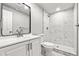 Modern bathroom featuring elegant vanity with marble-tiled stand up shower at 11383 Oakland Dr, Commerce City, CO 80640