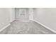 Neutral bedroom with a window and closet with neutral carpet and paint at 11383 Oakland Dr, Commerce City, CO 80640