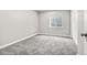 Neutral bedroom with a window and closet with neutral carpet and paint at 11383 Oakland Dr, Commerce City, CO 80640