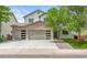 Charming two-story home featuring a brick facade, three-car garage, and a well-manicured front lawn at 11383 Oakland Dr, Commerce City, CO 80640
