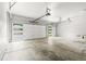 Spacious three car garage featuring modern garage doors and large concrete pad at 11383 Oakland Dr, Commerce City, CO 80640