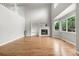 Bright living room with a fireplace, built-in shelving, and many windows providing natural light at 11383 Oakland Dr, Commerce City, CO 80640