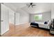 Spacious main bedroom boasts hardwood floors, vaulted ceiling, and a cozy window seating area at 11383 Oakland Dr, Commerce City, CO 80640