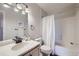 Bathroom featuring vanity, shower-tub, and neutral paint at 3727 Cactus Creek Ct # 204, Highlands Ranch, CO 80126