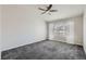 Neutral bedroom with vaulted ceiling, ceiling fan, carpet flooring and window with natural light at 3727 Cactus Creek Ct # 204, Highlands Ranch, CO 80126