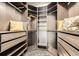 Walk-in closet featuring adjustable shelving and drawers at 3727 Cactus Creek Ct # 204, Highlands Ranch, CO 80126