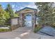 Clubhouse with stone pillars, large windows, and lush landscaping at 3727 Cactus Creek Ct # 204, Highlands Ranch, CO 80126