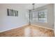 Dining area featuring wood floors, natural light, and modern pendant lighting at 3727 Cactus Creek Ct # 204, Highlands Ranch, CO 80126