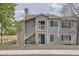Charming condo with beautiful blue door, upper balcony, and neat landscaping at 3727 Cactus Creek Ct # 204, Highlands Ranch, CO 80126