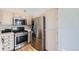 Bright kitchen boasts stainless steel appliances and ample counter space at 3727 Cactus Creek Ct # 204, Highlands Ranch, CO 80126