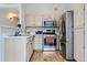 Well-equipped kitchen with stainless steel appliances and light wood cabinetry at 3727 Cactus Creek Ct # 204, Highlands Ranch, CO 80126