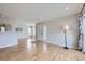 Open concept living room with wood floors and recessed lighting at 3727 Cactus Creek Ct # 204, Highlands Ranch, CO 80126