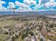 Expansive aerial view of the property showcasing neighborhood, mountain views, and proximity to Golden, CO at 5814 Cole Way, Arvada, CO 80004