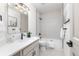 Bathroom featuring a tub, white cabinets, modern fixtures, and unique flooring at 5814 Cole Way, Arvada, CO 80004