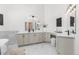 Spacious bathroom with double vanity, modern fixtures, bright lighting, and marble floors at 5814 Cole Way, Arvada, CO 80004