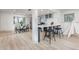 Cozy dining area with modern decor, natural light, and an open floor plan at 5814 Cole Way, Arvada, CO 80004