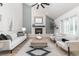 Bright living room featuring a fireplace, vaulted ceilings, and modern decor with comfortable furniture at 5814 Cole Way, Arvada, CO 80004