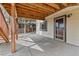Covered outdoor patio area with concrete flooring and access to the house at 5814 Cole Way, Arvada, CO 80004
